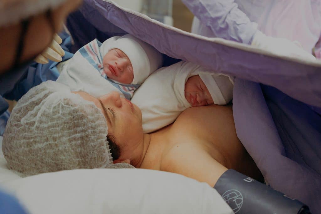 different types of birth, mum with her two babies after giving birth in hospital 